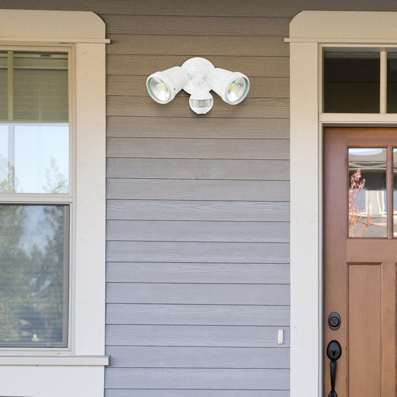 Outdoor security light fixture on a house exterior