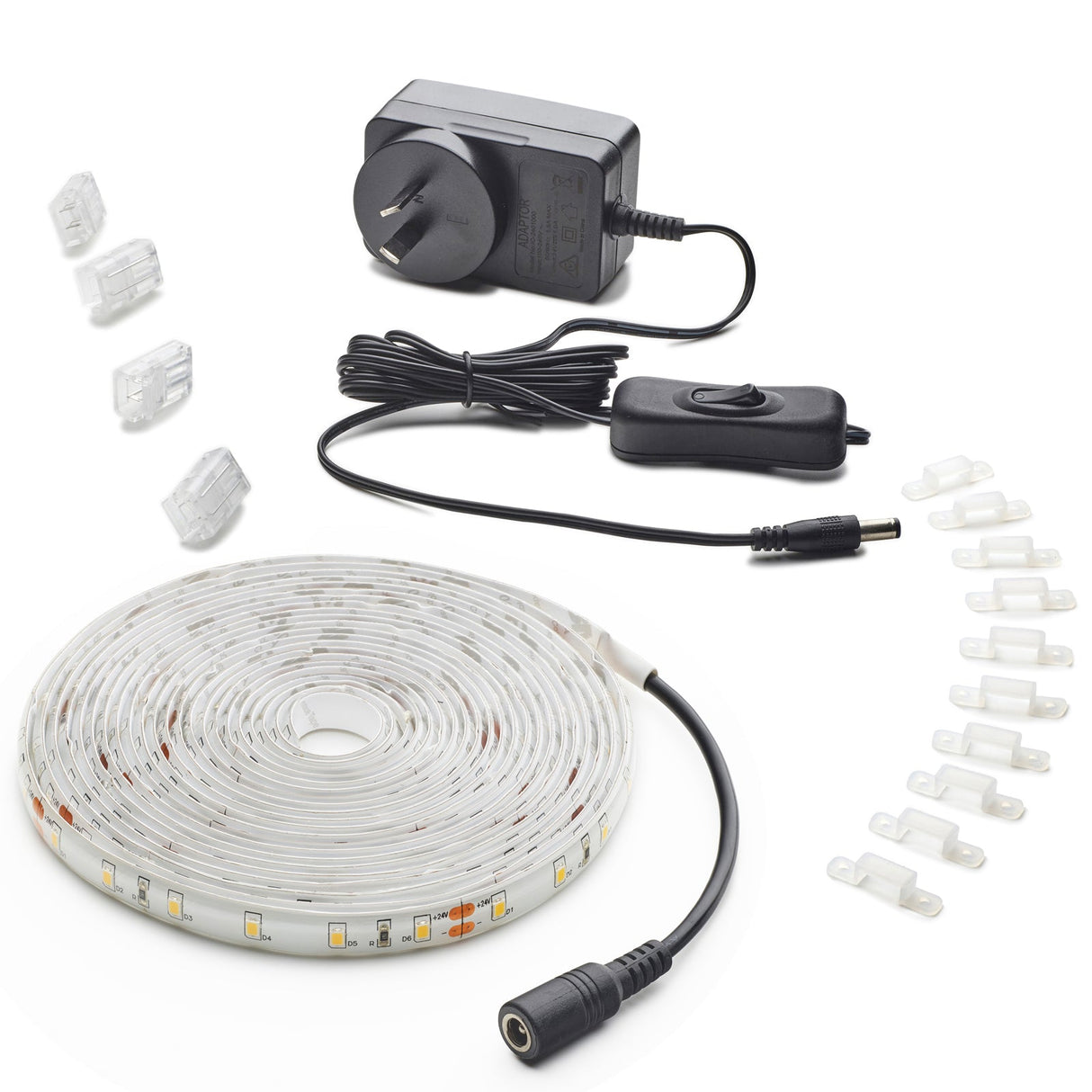 LED strip light kit with power adapter, connectors, and cable on a white background