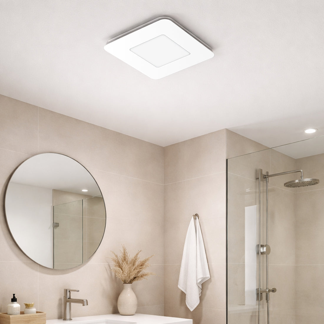 Bathroom interior with a square ceiling light fixture, round mirror, and shower area.