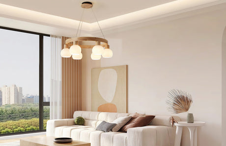 A cosy and modern living room illuminated by an aesthetically matching pendant light hanging from the ceiling