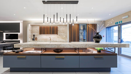 Pendant Light Hanging Over a Kitchen Island in a Luxurious Modern Kitchen