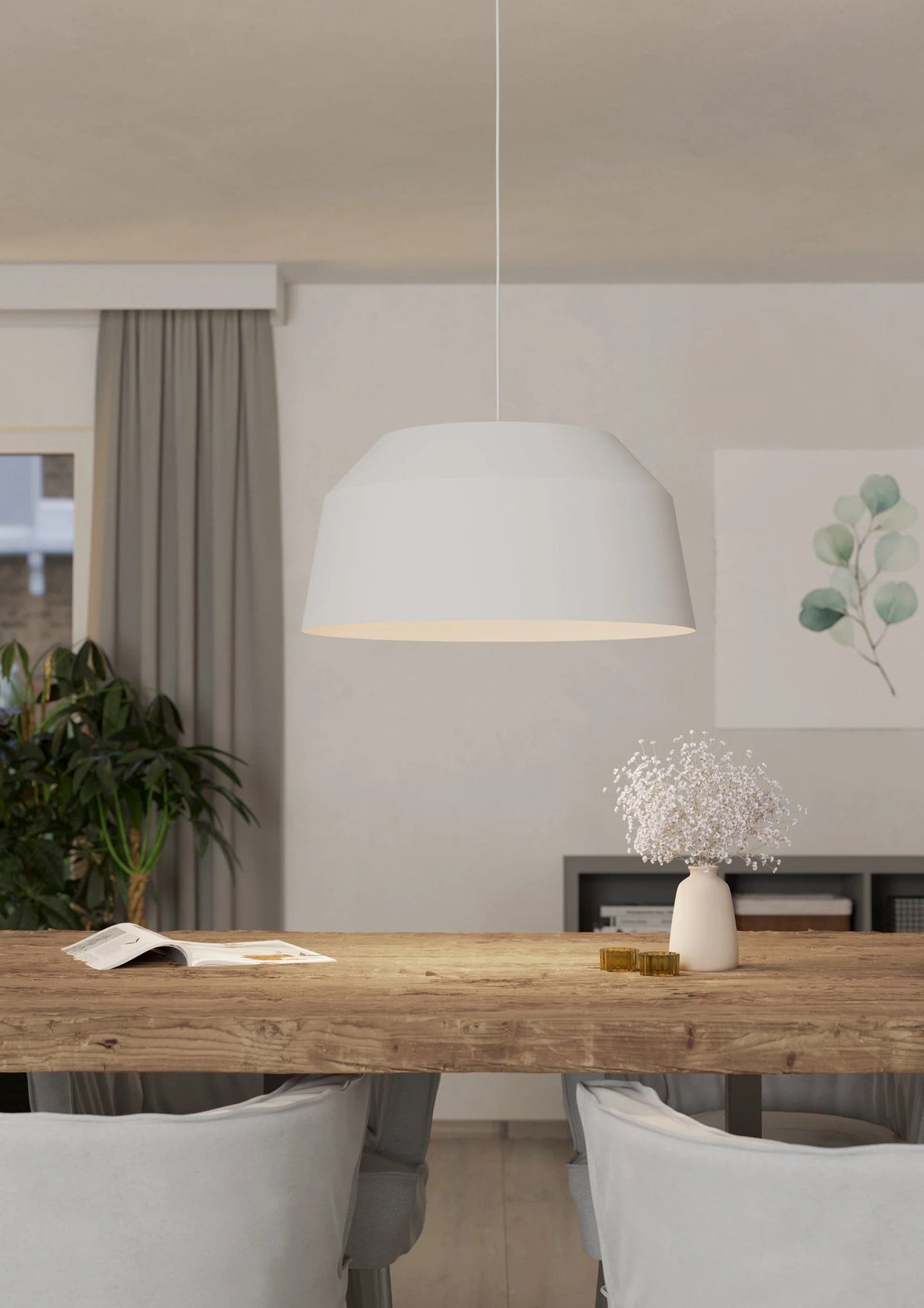 Dining room with wooden table, chairs, and a pendant light.