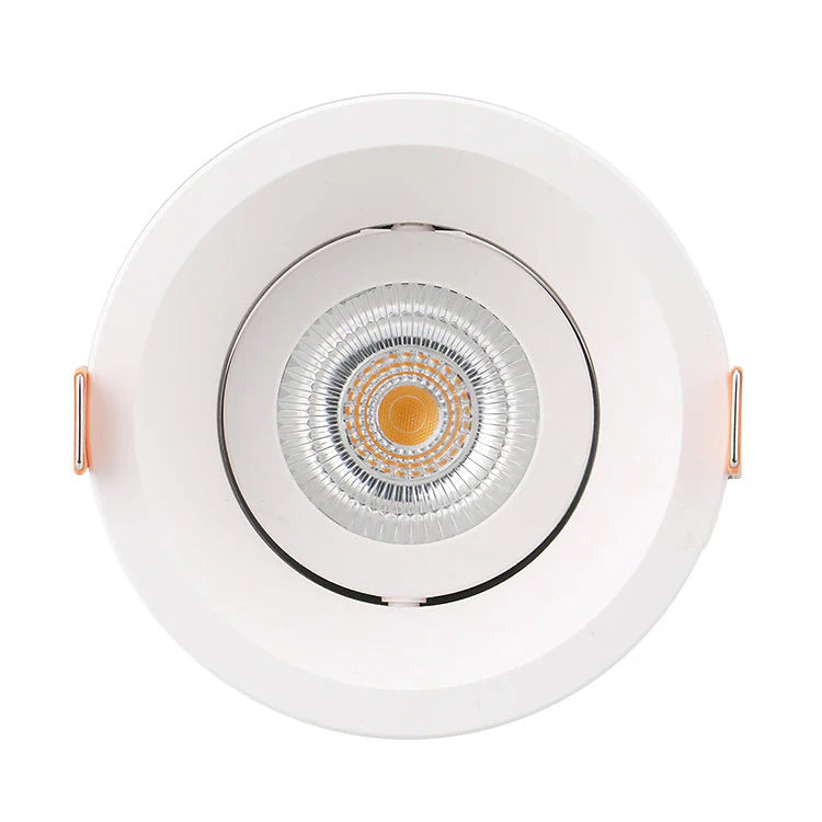 White recessed ceiling light with gold center on a white background