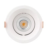 White recessed ceiling light with gold center on a white background