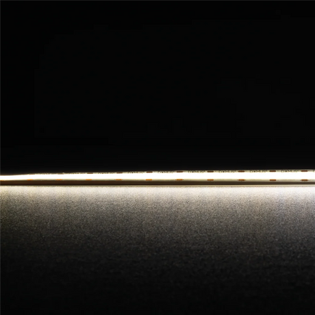 Thin metallic rod on a reflective surface High CRI90 Domus Plex COB LED strip for premium illumination with a dark background