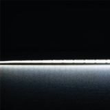 Flexible IP54 COB LED tape light by Domus Plex LED strip light on a black background