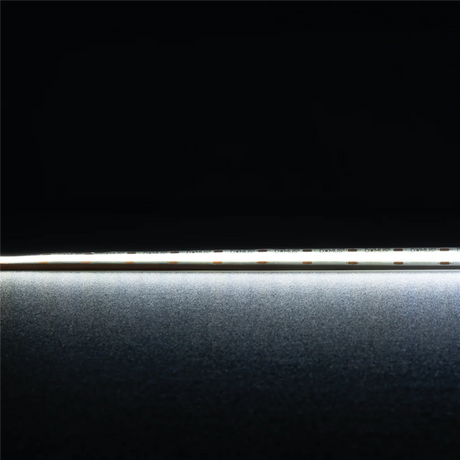 Flexible IP54 COB LED tape light by Domus Plex LED strip light on a black background