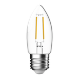 Clear glass Domus LED candle bulb with warm white light on a white background