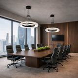 Modern conference room with large wooden table and chairs, large windows, and cityscape view.
