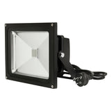 Black flood light with power cord on a white background