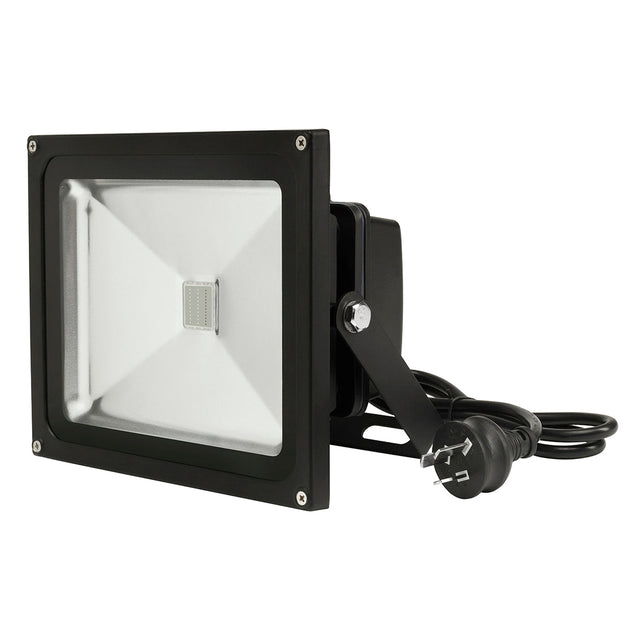 Black flood light with power cord on a white background