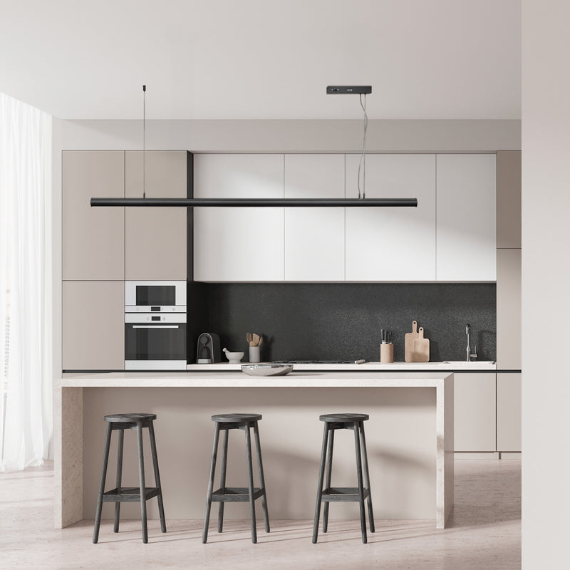 Modern kitchen with white cabinets, black backsplash, and bar stools.