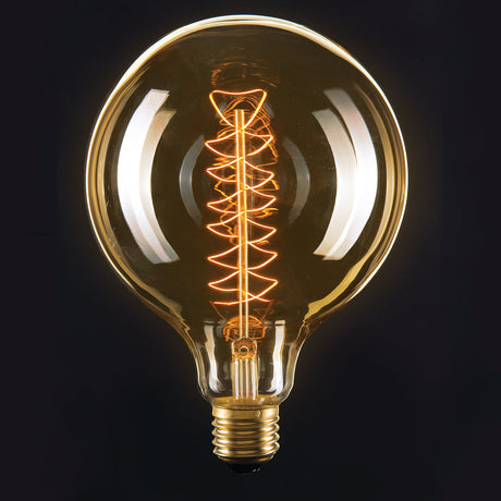 Vintage-style light bulb with spiral filament on a black background