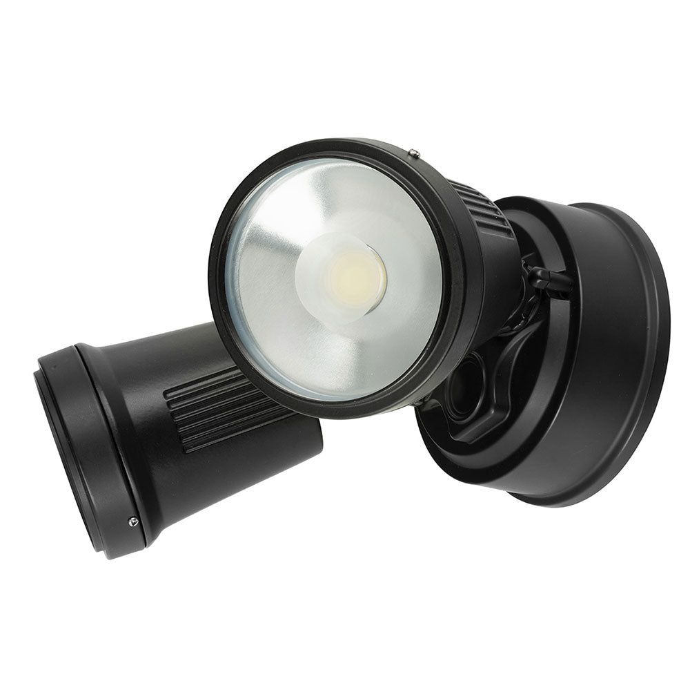 Black outdoor security light on a white background