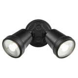 Black outdoor flood light fixture on a white background