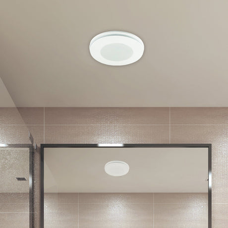 Ceiling light fixture in a bathroom with tiled walls and a shower area.