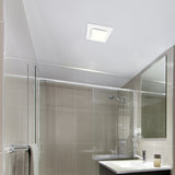 Modern bathroom with glass shower enclosure, sink, and mirror.