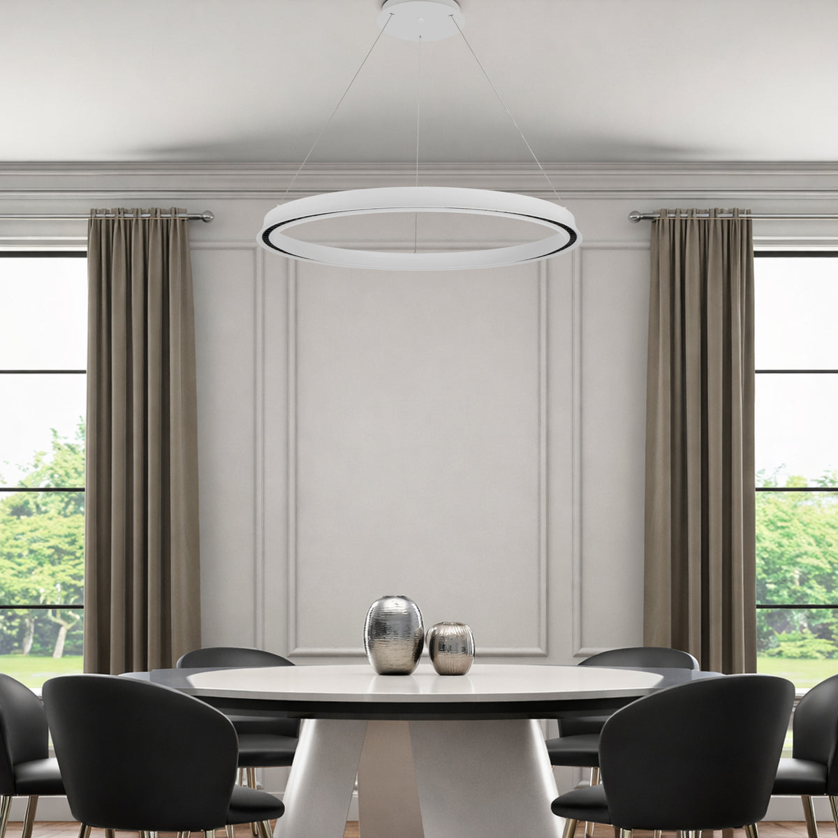 Modern dining room with a round table and chairs, featuring a ceiling light fixture.